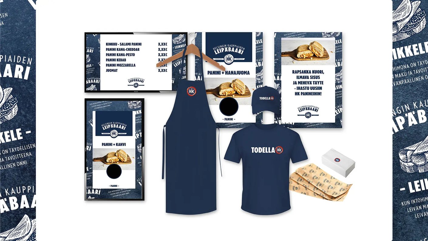 HK Leipäbaari julisteita, hinnastoja, lippis, t-paita, essu ja rasia.